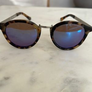 Tortoise Sunglasses with blue lenses.